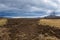 A beautiful lowland landscape overlooking the Palava region. Dark clouds in the sky. Fields and meadows