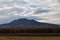 A beautiful lowland landscape overlooking the Palava region. Dark clouds in the sky. Fields and meadows