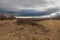 A beautiful lowland landscape overlooking the Palava region. Dark clouds in the sky. Fields and meadows