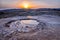 Beautiful lunar landscape with a sunset over the muddy volcanoes