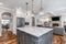 A beautiful, luxurious kitchen looking towards the living room