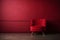 Beautiful luxury classic velvet red clean interior room in classic style with velvet red soft armchair. Vintage antique