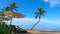 Beautiful luxury hotel lounge chairs resting on the breathtaking tropical beach