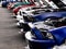 Beautiful luxury mustang cars in a row with open hoods at a large car show