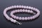 Beautiful and luxury Pink Quartz pearl necklace on a reflective
