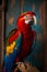 Beautiful macaw parrot on a wooden branch in a cage