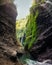 Beautiful Madakaripura waterfall in rocky valley