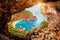 Beautiful magical view of the Gyali beach in Corfu, Greece through a hole in the rock at sunny day. amazing places. popular