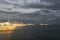 Beautiful magical view of Zadar old-town across a sea and harbour with dark clouds and sunset light