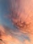 Beautiful magnificent orange pink clouds on blue sky background