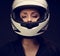 Beautiful makeup woman looking in white motorcycle helmet o