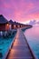 Beautiful Maldives travel concept with willas on the water, purple sunset vibes