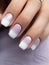 Beautiful manicure. Long almond shaped nails. Nail design. Manicure with gel polish. Close-up of the hand of a young