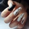 Beautiful manicure for long nails in black and white