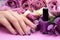 Beautiful manicure, polish is a violet color.