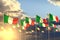 Beautiful many Italy flags on sunset placed in row with selective focus and space for text - any feast flag 3d illustration