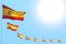 Beautiful many Spain flags placed diagonal on blue sky with place for content - any occasion flag 3d illustration