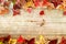 Beautiful maple leaves on vintage wooden background,