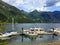 A beautiful marina full of boats and surrounded by forests and mountains in a remote inlet in Indian Arm, outside Vancouver