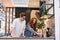 Beautiful married couple choosing new kitchen design in the market