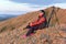 a beautiful mature woman meets the dawn on the Nurali ridge in the southern Urals