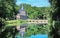 Beautiful medieval dutch castle, green forest, water moat - Arcen, Limburg, Netherlands