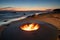 The beautiful metal round a fireplace stands on the sandy coast with a tidal wave at sunset, stones, sand, waves, the