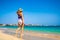 Beautiful mid-adult woman walking on sunny beach Santa Maria, Sal Island, Cape Verde