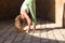 Beautiful middle-aged woman doing yoga in the street. The woman is doing relaxation and tranquility postures. Woman is wearing