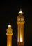Beautiful minarets of Al Fateh Mosque of Bahrain illuminated at night
