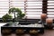 Beautiful miniature zen garden, candles and oil lamps on table