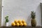 Beautiful and minimal composition of fruit standing on a wooden shelf. Lemon and pineapple decoration outside a tourist restaurant
