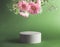 Beautiful minimal modern product display with podium and hanging pink flowers at green background. Place for beauty products or