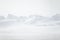 A beautiful, minimalist landscape of flat, snowy Norwegian field.