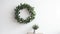 Beautiful Minimalist Plant And Wreath On White Table