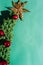 Beautiful minimalistic Christmas background. Handmade knitted Christmas tree with a Golden tinsel star on the top of the head and