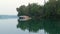 Beautiful Minnesota lake shore with cabins and water craft in evening clip.