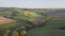 Beautiful and miraculous colors of green spring panorama landscape of Tuscany, Italy. Sunny morning near Pienza. Aerial view.