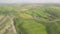 Beautiful and miraculous colors of green spring panorama landscape of Tuscany, Italy. Sunny morning near Pienza. Aerial view.