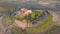 Beautiful and miraculous colors of green spring panorama landscape of Tuscany, Italy. Sunny morning near Pienza. Aerial view.