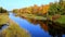 Beautiful Mississippi River with autumn foliage and boat docks and benches.