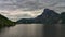 Beautiful misty and cloudy landscape with lake and mountains in summer. Natural colorful background. Traunsee lake in the Austrian