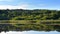 Beautiful misty scenic landscape in summer.Ponds  near forest