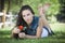 Beautiful Mixed Race Girl Portrait Laying in Grass