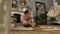 Beautiful Mixed Young Woman Sits on the Floor in a Luxury House Smelling Oils