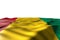 Beautiful mockup photo of Guinea flag lying flat with perspective view isolated on white with place for your content - any holiday