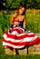 Beautiful model draped in the American Flag.