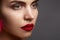 Beautiful model with fashion make-up. Close-up portrait woman with glamour lip gloss makeup and bright eye shadows.