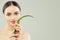 Beautiful model woman with aloe vera leaf portrait