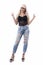 Beautiful modern funky young blonde woman in jeans showing two fingers peace hand sign